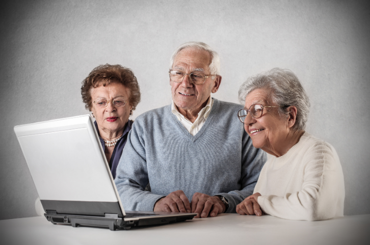 Seniors looking at a laptop